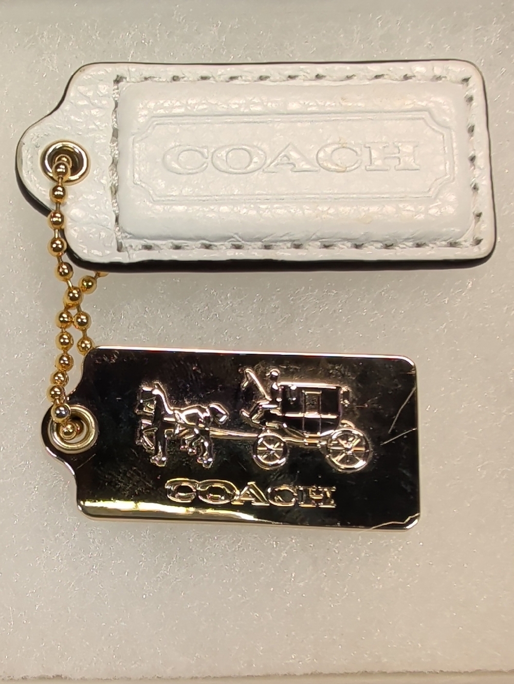 Coach White Leather and Gold Hangtag